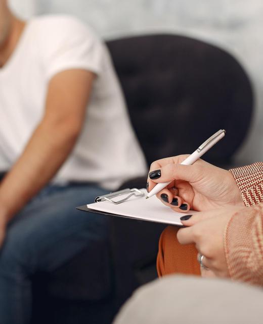 In the psychologist's office. Man and woman talking